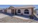A well-maintained home with a desert landscape and a spacious concrete driveway and walkway at 450 N 110Th St, Mesa, AZ 85207