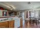This warm kitchen transitions to the living room, dining area and the outdoor living space at 450 N 110Th St, Mesa, AZ 85207