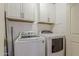 Practical laundry room equipped with a washer and dryer for convenience at 450 N 110Th St, Mesa, AZ 85207