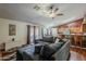 Living room showcasing a large sectional, sliding glass doors and an open concept layout with wood floors at 450 N 110Th St, Mesa, AZ 85207