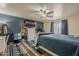 Comfortable main bedroom with stylish decor, including a ceiling fan and textured accent wall at 450 N 110Th St, Mesa, AZ 85207