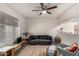 Bright living room with ceiling fan, stylish rug, and comfortable seating arrangement at 461 W Holmes Ave # 350, Mesa, AZ 85210