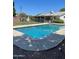 Sparkling pool with an extended deck area perfect for relaxing and outdoor entertaining on a sunny day at 4814 N 35Th St, Phoenix, AZ 85018