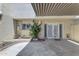 Back patio with french doors, small garden, shaded overhang, and room to customize for comfortable outdoor enjoyment at 527 N Lesueur --, Mesa, AZ 85203
