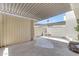A back patio features a shaded overhang and neutral color palette, ready for customization and outdoor living at 527 N Lesueur --, Mesa, AZ 85203