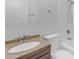 Bathroom featuring a wood vanity with a sink, toilet and tiled shower/tub combo at 527 N Lesueur --, Mesa, AZ 85203