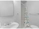 Bathroom featuring a walk-in shower with seashell shower curtain and sink at 527 N Lesueur --, Mesa, AZ 85203