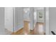 A view into a well-lit room with wood flooring and a ceiling fan at 527 N Lesueur --, Mesa, AZ 85203