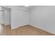 Bedroom with wood flooring and white walls, featuring a closet at 527 N Lesueur --, Mesa, AZ 85203