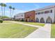 Well-maintained two-story townhomes showcase mature landscaping, sidewalk, and inviting exteriors in a desirable location at 527 N Lesueur --, Mesa, AZ 85203