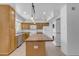Updated kitchen with stainless steel appliances, wood cabinets, and a central island at 527 N Lesueur --, Mesa, AZ 85203