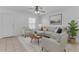 Bright living room featuring tile flooring, neutral furniture, and a ceiling fan for a comfortable atmosphere at 527 N Lesueur --, Mesa, AZ 85203