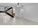 Open-concept living space with tile floors, a modern staircase, and natural light at 527 N Lesueur --, Mesa, AZ 85203