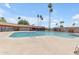 Large community pool provides a refreshing oasis surrounded by shaded seating and tropical landscaping for residents and guests at 527 N Lesueur --, Mesa, AZ 85203