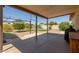 Large covered back patio with concrete and brick paving, leading to a landscaped backyard at 538 E Estevan Ave, Apache Junction, AZ 85119
