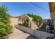 Backyard showcasing a garden area with climbing plants and a white lattice fence at 538 E Estevan Ave, Apache Junction, AZ 85119