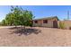 Charming single-story home with mature trees, rock landscaping, and a private gated courtyard at 538 E Estevan Ave, Apache Junction, AZ 85119