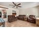 Spacious living room with tile flooring, comfortable seating, and a view into the updated kitchen area at 538 E Estevan Ave, Apache Junction, AZ 85119