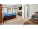 This bedroom offers closet, shelving, carpet and backyard access at 538 E Estevan Ave, Apache Junction, AZ 85119