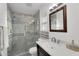 Beautiful bathroom featuring a tiled shower, modern fixtures, and a spacious vanity at 6201 E Waltann Ln, Scottsdale, AZ 85254