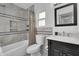 Cozy bathroom with a shower-tub combination, and a dark vanity at 6201 E Waltann Ln, Scottsdale, AZ 85254