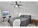 Comfortable bedroom with a workspace area, neutral tones, and a ceiling fan at 6201 E Waltann Ln, Scottsdale, AZ 85254