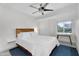 Bright bedroom featuring a modern bed frame, large windows and a blue rug at 6201 E Waltann Ln, Scottsdale, AZ 85254