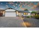 Charming single-Gathering home featuring a well-manicured front yard, desert landscaping, and a two-car garage at 6201 E Waltann Ln, Scottsdale, AZ 85254