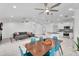 Open-concept living space with modern furnishings, dining area, and kitchen island at 6201 E Waltann Ln, Scottsdale, AZ 85254