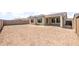 Large backyard with space for pool and outdoor activities. Covered patio with sliding glass doors at 7661 W Meadowlark Way, Florence, AZ 85132