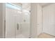 Modern bathroom featuring a glass-enclosed shower with white tile and chrome fixtures at 7661 W Meadowlark Way, Florence, AZ 85132