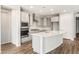 Contemporary kitchen featuring an island, sleek appliances, and plenty of storage for culinary enthusiasts at 7661 W Meadowlark Way, Florence, AZ 85132