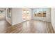 Bright living room showcasing wood-look floors and sliding glass doors to outdoor space at 7661 W Meadowlark Way, Florence, AZ 85132