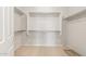 Spacious walk-in closet with adjustable shelving and carpeted floor, perfect for storage at 7661 W Meadowlark Way, Florence, AZ 85132