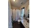 Compact bathroom with a shower, toilet, and a vanity sink, designed for essential functionality at 7920 W Glendale Ave # 39, Glendale, AZ 85303