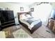 Comfortable bedroom featuring a large bed, carpeted floor, and dresser at 7920 W Glendale Ave # 39, Glendale, AZ 85303