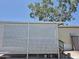 The side of the home with a carport that has a lattice surround and concrete flooring at 7920 W Glendale Ave # 39, Glendale, AZ 85303