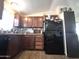 Well-equipped kitchen with wood cabinets, modern appliances, and ample counter space at 7920 W Glendale Ave # 39, Glendale, AZ 85303