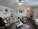 Comfortable living room with cozy seating, decorative accents, and a ceiling fan for added comfort at 7920 W Glendale Ave # 39, Glendale, AZ 85303
