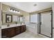 Bathroom featuring a glass shower, soaker tub, and double vanity for a spa-like experience at 1125 E San Carlos Way, Chandler, AZ 85249