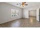 Bright bedroom with tile flooring, ceiling fan, and ample natural light at 1125 E San Carlos Way, Chandler, AZ 85249