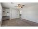 Bedroom with carpet, ceiling fan, window and built-in desk adjacent to a large closet at 1125 E San Carlos Way, Chandler, AZ 85249