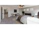 Neutral bedroom features matching chairs, dresser, and fan for added comfort and style at 1125 E San Carlos Way, Chandler, AZ 85249