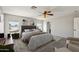 Large bedroom featuring natural light from the windows, a ceiling fan, and stylish neutral decor at 1125 E San Carlos Way, Chandler, AZ 85249