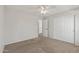 Bedroom with neutral carpet, ceiling fan, and large closet offers space and comfort at 1125 E San Carlos Way, Chandler, AZ 85249