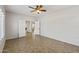 Spacious bedroom with tile flooring, ceiling fan, and double doors at 1125 E San Carlos Way, Chandler, AZ 85249