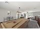 Open living space with billiard table, lounge area, and entertainment setup, perfect for entertaining at 1125 E San Carlos Way, Chandler, AZ 85249