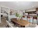 Bright dining area featuring wood table, stylish chairs, and seamless transition to the modern kitchen at 1125 E San Carlos Way, Chandler, AZ 85249