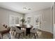 Dining area featuring wood table, stylish chairs, and windows with plantation shutters at 1125 E San Carlos Way, Chandler, AZ 85249