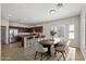 Modern kitchen with stainless steel appliances and a spacious dining area at 1125 E San Carlos Way, Chandler, AZ 85249